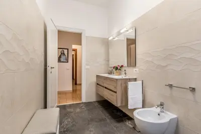 a bathroom with a sink and a toilet at La Casa di Umberto in Rome