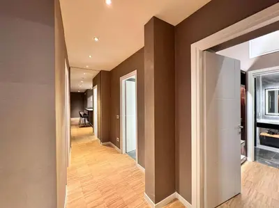 a hallway of a home with brown walls at The Condotti - Luxury serviced apartment in Rome