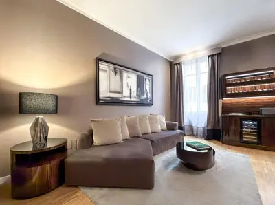 a living room with a couch and a table at The Condotti - Luxury serviced apartment in Rome