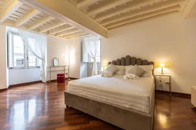 a bedroom with a large white bed in a room at Piazza Navona Classy & Large Apartment in Rome