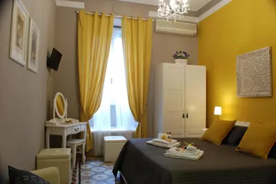 a bedroom with a bed with towels on it at Costantino Primo Holiday - Roma St.Pietro in Rome