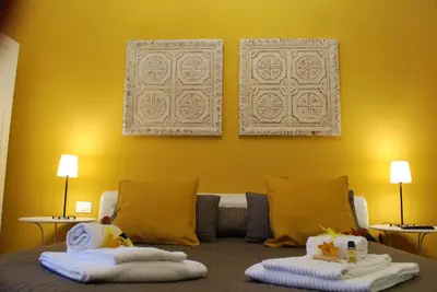 a room with a bed with two towels on it at Costantino Primo Holiday - Roma St.Pietro in Rome