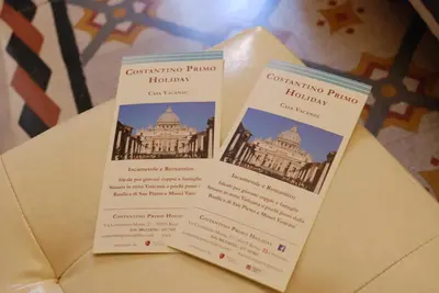 two pamphlets sitting on top of a table at Costantino Primo Holiday - Roma St.Pietro in Rome