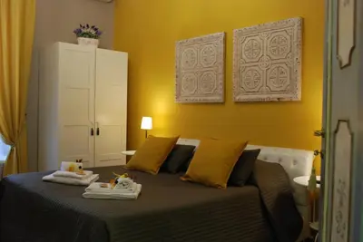 a bedroom with a bed with two towels on it at Costantino Primo Holiday - Roma St.Pietro in Rome