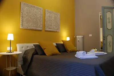 a bedroom with a bed with two towels on it at Costantino Primo Holiday - Roma St.Pietro in Rome