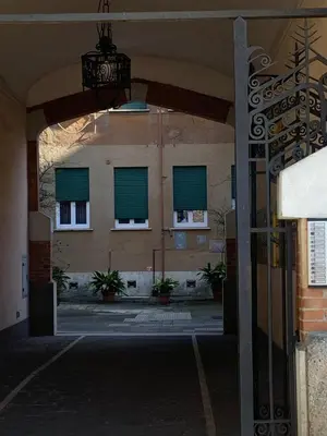 an open door to a building with green windows at Appartamento degli Eroi in Rome