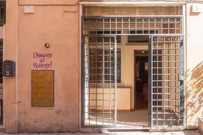 an open door of a building with a gate at Domus Reginella, nella zona più richiesta di Roma in Rome