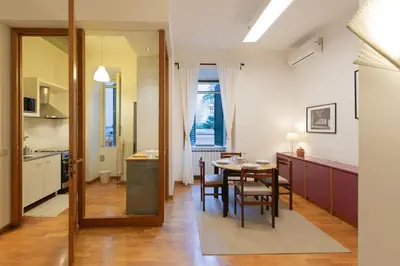 a kitchen and dining room with a table and a dining room at Yes Holiday Rome in Rome