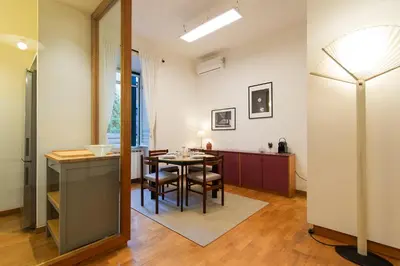 a kitchen and dining room with a table and chairs at Yes Holiday Rome in Rome