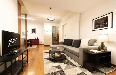 a living room with a couch and a table at Yes Holiday Rome in Rome
