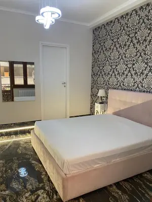 a bedroom with a large white bed in a room at Suite and room in Rome
