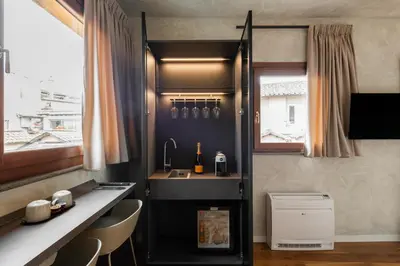 a living room with a couch and a bed at Residenza Leutari in Rome