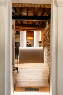 two chairs and a table in a room with a painting at Residenza Leutari in Rome