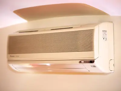a white microwave oven hanging from a ceiling at Sweet Home Colosseo in Rome