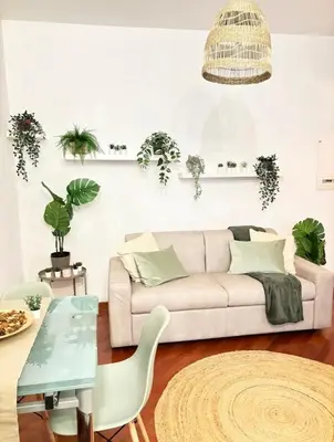 a living room with a couch and a table at Saulo Guest House - A 10 minuti da Colosseo in Rome