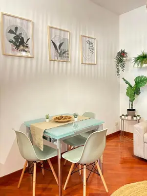 a dining room with a blue table and chairs at Saulo Guest House - A 10 minuti da Colosseo in Rome