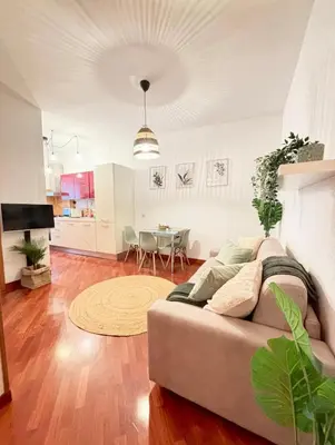 a living room with a couch and a table at Saulo Guest House - A 10 minuti da Colosseo in Rome
