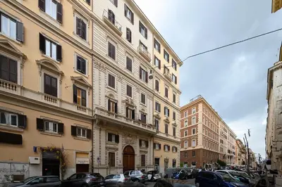 a row of buildings in a city with parked cars at Gracchi Apartment Prati in Rome