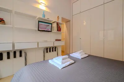 a room with a bed with two towels on it at Gracchi Apartment Prati in Rome