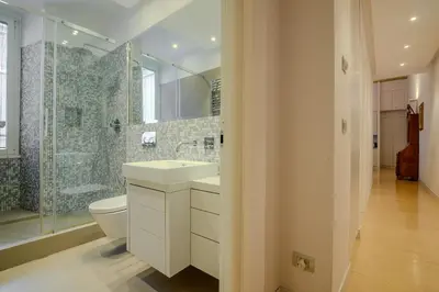 a bathroom with a toilet and a sink and a shower at Gracchi Apartment Prati in Rome