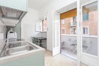 a kitchen with a sink and a table at via Madonna del Riposo in Rome