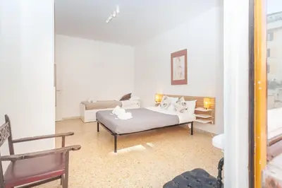a living room with a bed and a couch at via Madonna del Riposo in Rome