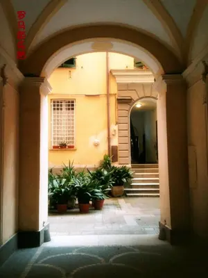 an entrance to a building with potted plants at Richbaby in Rome