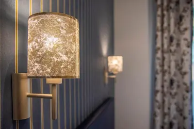 a pair of lights on a wall in a room at La Grande Bellezza Guest House Rome in Rome