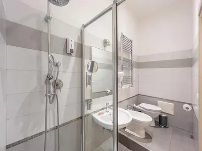 a bathroom with a shower and a sink and a toilet at La Grande Bellezza Guest House Rome in Rome