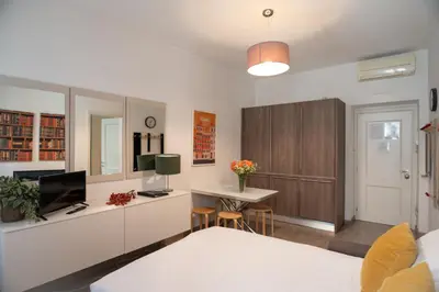 a living room with a bed and a desk at Banchi Vecchi Stay Apt Suite Navona in Rome