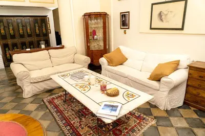 a living room with two couches and a table at Colosseum Charming Loft - Santa Maria in Carinis in Rome