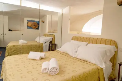 a bedroom with two beds with towels on them at Colosseum Charming Loft - Santa Maria in Carinis in Rome