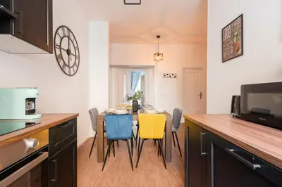 a kitchen with a table and chairs in a kitchen at Termini apartments in Rome