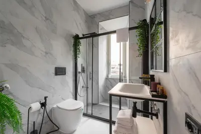 a bathroom with a shower and a toilet and a sink at Termini apartments in Rome