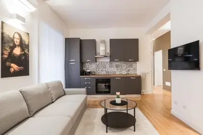 a living room with a couch and a table at THE FIFTH Properties Luxury Apartment near LUISS Rome Viale Libia in Rome