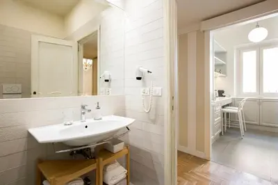 a bathroom with a sink and a mirror at AV Domus Propaganda in Rome