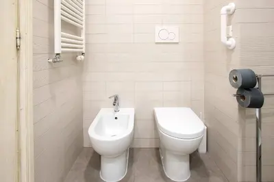 a small bathroom with a toilet and a sink at AV Domus Propaganda in Rome