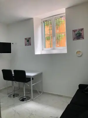 a white room with a desk and two chairs at Dolce Vita Romana in Rome