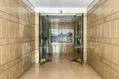 an elevator in a building with a painting on the wall at Cipro Vatican House in Rome