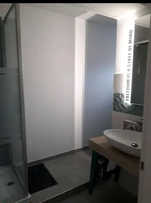 a white bathroom with a sink and a shower at Stanza in superattico, terrazzato, luminoso, accogliente, bagno privato in Rome