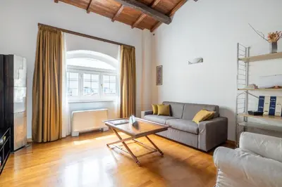 a living room with a couch and a coffee table at Baccina 45 - Cozy Quiet Apt in Rome