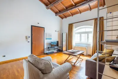 a living room with a couch and a table at Baccina 45 - Cozy Quiet Apt in Rome