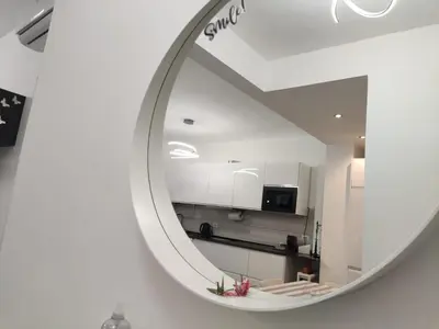 a mirror reflection of a kitchen in a room at ROMAN'S HOUSE in Rome