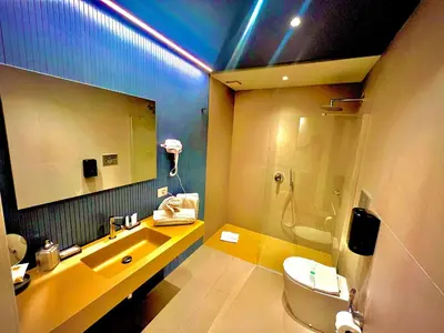 a bathroom with a sink and a toilet and a mirror at L'Isola che non c'è in Rome