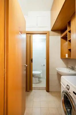 a bathroom with a toilet and a sink at 4BNB - Reale House in Rome