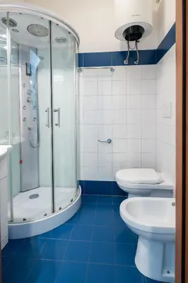 a bathroom with two toilets and a shower at 4BNB - Reale House in Rome