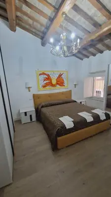 a bedroom with a large bed in a room at Borgo Pio 182 Vatican Suite in Rome