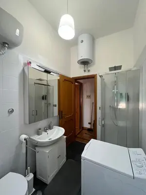 a bathroom with a sink and a shower and a toilet at Balduina View in Rome