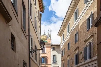 an alley between two buildings in a city at Navona Modern by Rental in Rome in Rome