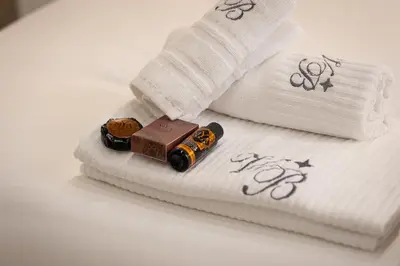 a close up of two towels with a remote control on them at Navona Modern by Rental in Rome in Rome